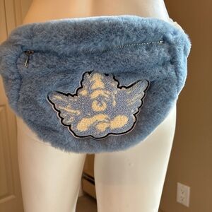 Fuzzy light blue belt bag with angel appliqué